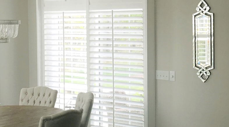 Sliding door shutters in dining room